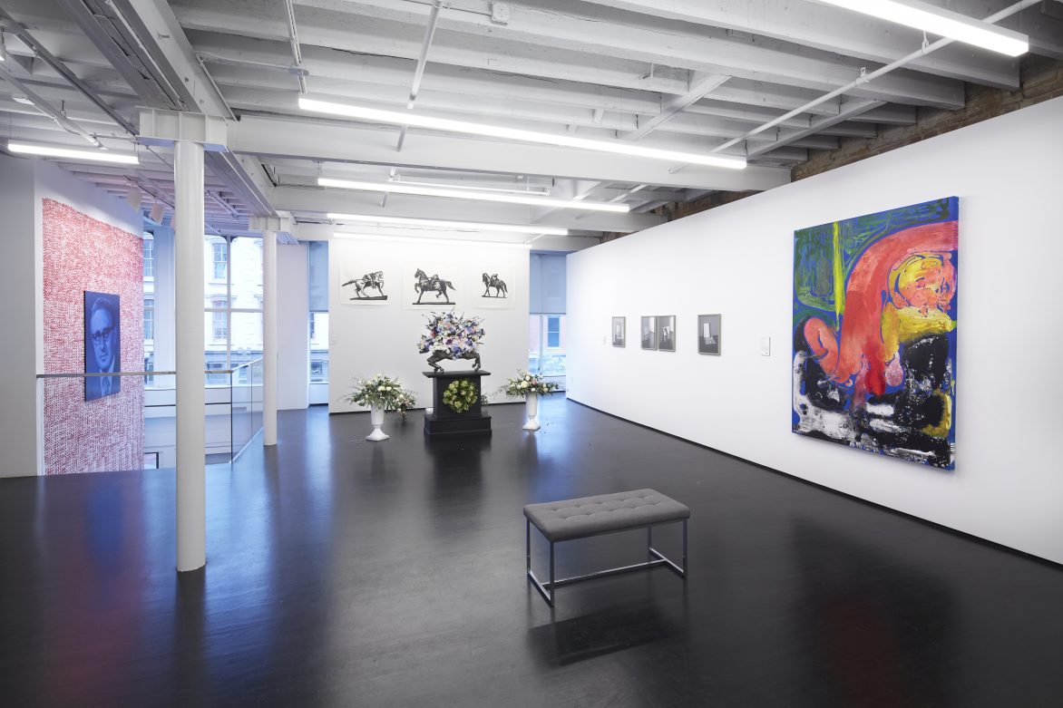 Installation view of an exhibition featuring paintings and sculpture.