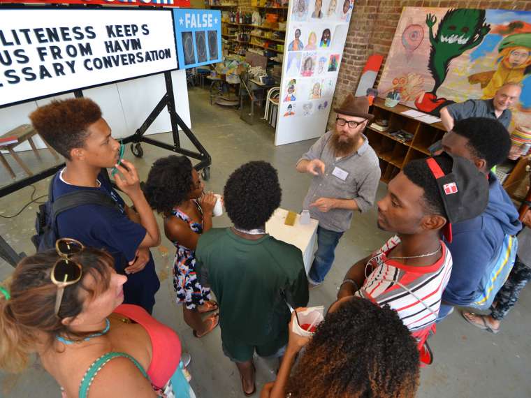 In 2014, Space One Eleven invited the public to play PUBLIC FORUM, with artist in residence, Steve Lambert. Designed to create a large scale forum around current events and fundamental myths, PUBLIC FORUM invites you to vote whether the statement on the marquee is true or false. Imagine a mix of Family Feud, Let’s Make a Deal, the front page of the newspaper, and the best college seminar class you ever took, while discussing topics important to you. With statements like “Slavery is over, My voice is heard & I have equal rights, and Football is more important than Jesus,” Lambert pulled Birmingham locals into a gameshow-like environment to spark these conversations.