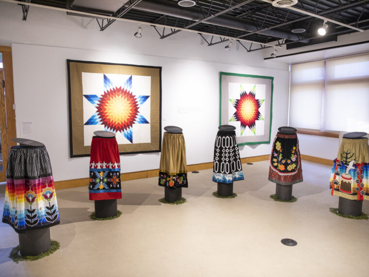 Piitwewetam: Making is Medicine exhibition 2023.
Ryan Gustafson & Shannon Gustafson, Applique Ribbon Skirts and Star quilts.
Photo credit: TJ Turner Pictures.