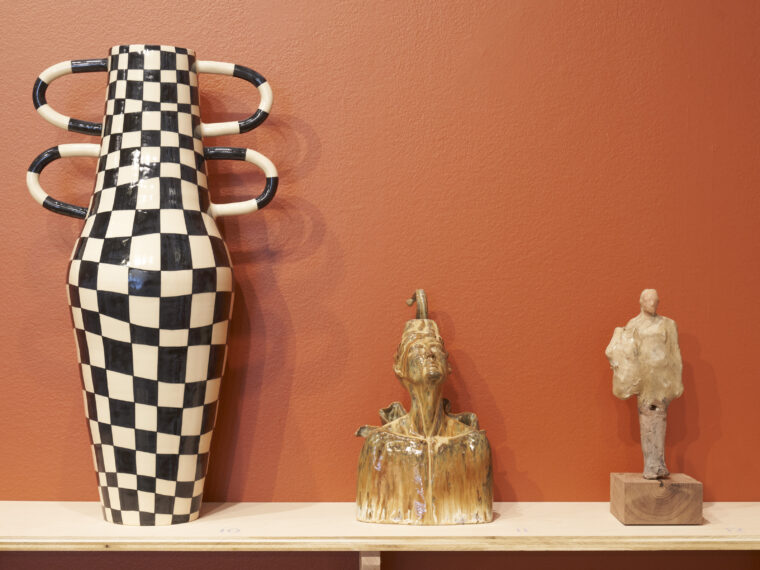 Installation view (left to right): Diana Hoover, Tone Amphora Two, 2024. 24 x 13 x 4.25 inches. Carolina Rojas, Mud Angel, 2024. 15 x 6 x 3 inches. Nicholas McDonald, The Birth of Cool, 2025. 5 x 5 x 10 inches. Courtesy Center for Craft. Photo by Black Box Photography.